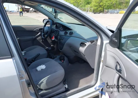 2001 Ford Focus Lx z USA, uszkodzony, nr VIN 1FAFP33P61W315115